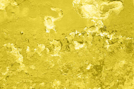 Concrete Yellow colorful wall surface texture. Abstract grunge bright illuminating color background with aging effect. Copyspaceの写真素材