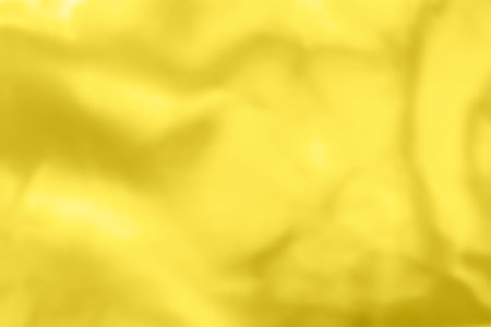 Abstract holographic yellow background. Liquid neon illuminating foil in unicorn style. Marble iridescent futuristic texture. Trend style 90s.の写真素材