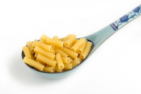 Pasta in a spoon. On a white background. Not welded.の写真素材