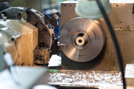 Production of parts on a metal lathe.Rotating parts, flying coolant sprayの写真素材