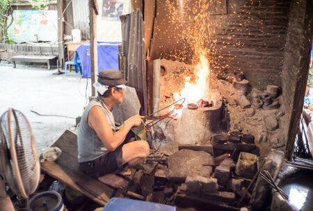 Worker is making a monk's bowl or almsbowl by handmadeのeditorial素材