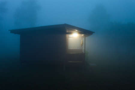 house of wooden beam in the mist