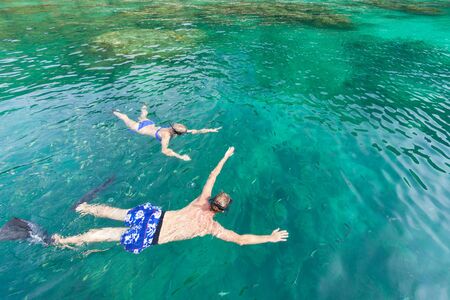 skindiving in the sea with goggles and a snorkelの写真素材