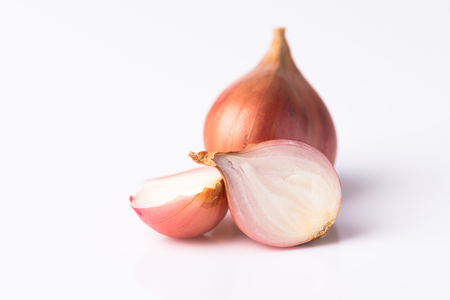 Red thai onion on white backgroundの写真素材