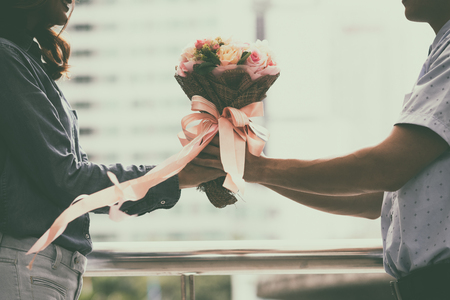 retro wedding bouquet with the flower in hands of the brideの写真素材
