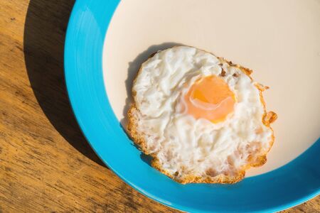 Fried eggs breakfast cooked on the plate.の写真素材