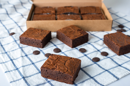 Close up sweet chocolate brownie on tableclothの写真素材