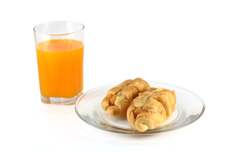 Sausage and Cheese Croissant with orange juice on a white backgroundの写真素材