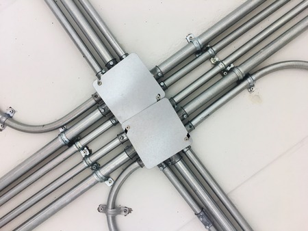 Metal electric box on ceilingの写真素材