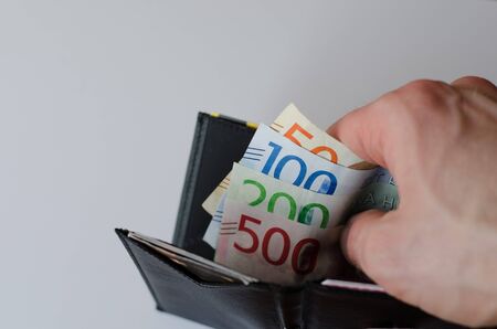 Black leather wallet showing swedish bills, new as of 2016-2017の写真素材