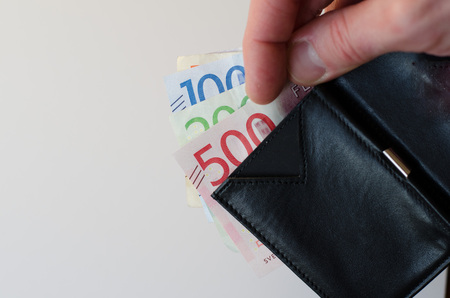 Black leather wallet showing swedish bills, new as of 2016-2017の写真素材