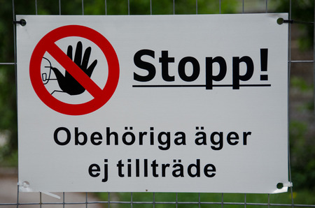 Stop sign ahead of a construction site in Stockholm, Sweden.