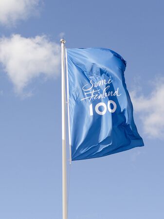 Naantali, Finland - August 3 2017. The flags for the celebration of Finlands first 100 hundred years wave in the wind on a sunny summers day in the city of Naantali near Turku, Finland.のeditorial素材