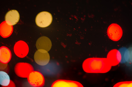 Blurry illuminated/lights in traffic in the evening