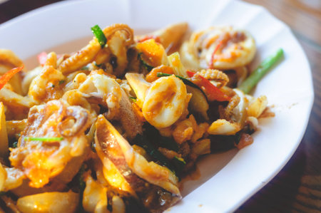 Delicious Spicy Stir Fried Squid With Egg Yolkの写真素材