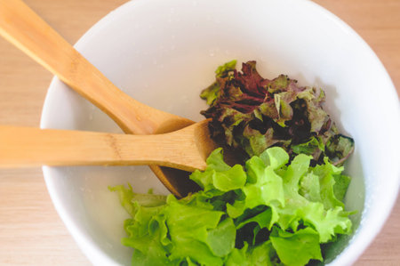 Green Salad In Porcelain Bowl Ready For Mixingの写真素材