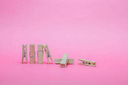 Wood Clip Set On Pastel Pink Backgroundの写真素材