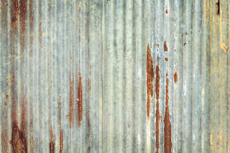 Old zinc vintage fence wall texture for background, pattern of rusty on metal panel.の写真素材