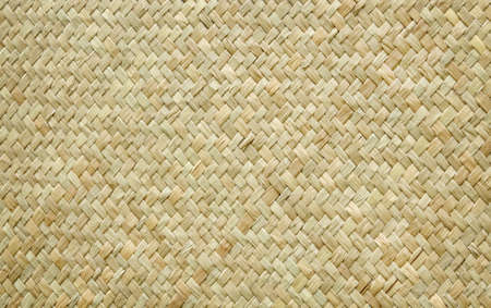 Reed weaving mat texture in natural pattern for background and design art work.