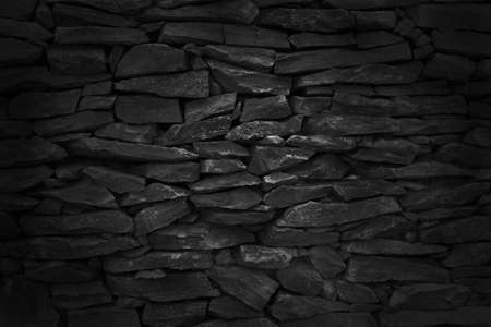 Black brick stone wall texture background with vintage style for design art work.の写真素材