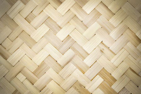 Old bamboo weave texture background, pattern of woven rattan mat in vintage style.