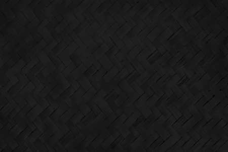 Old black bamboo weave texture background, pattern of woven rattan mat in vintage style.の写真素材