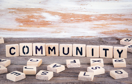 Community from wooden letterson on wooden background.の写真素材