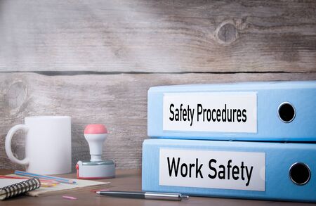 Work Safety and Safety Procedures. Two binders on desk in the office. Business background.の写真素材