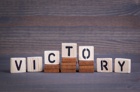 Victory from wooden letters. Abstract business and success background.の写真素材
