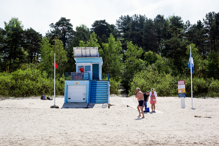 Jurmala, Latvia - May 20, 2017: Rescue station with solar panels on the roof. Lifeguard watches the beachのeditorial素材