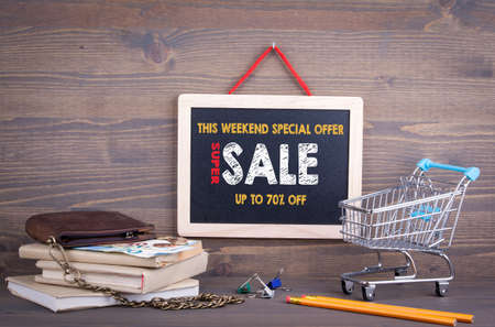 Super Sale, this weekend special offer. Chalkboard on a wooden background.の写真素材
