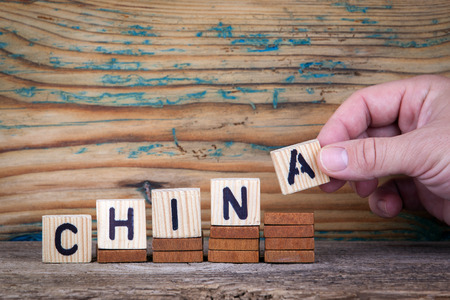 china. Wooden letters on the office desk, informative and communication background.の写真素材