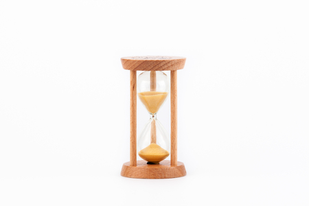 Sandglass, hourglass or egg timer on white table showing the last second or last minute or time out.の写真素材