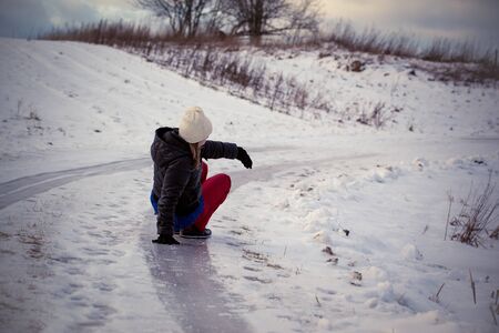Slip on the slippery ice and snow on the road track at the country in freezing winter day.の写真素材