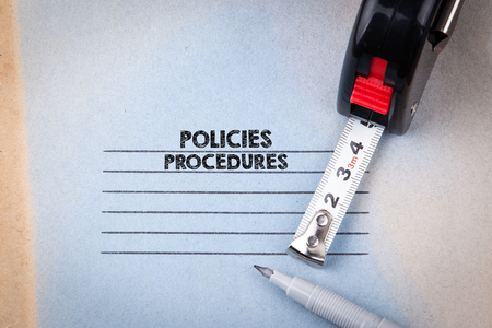 Policies and Procedures. notebook with header. business and success background.の写真素材