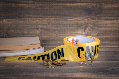 education and reform. career opportunities and profits. yellow caution tape on wooden, abstract...