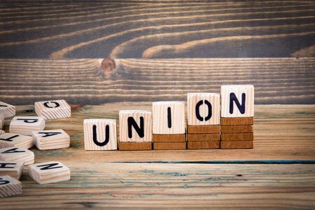 Union. Wooden letters on the office desk, informative and communication background.の写真素材