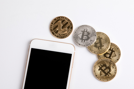 crypto currency, golden bitcoin and mobile phone on white background.の写真素材