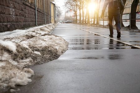 melting snow in the city streets. spring backgroundの写真素材