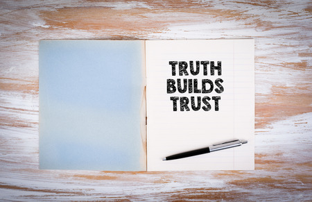 Truth builds trust. Copybook on the desktop.の写真素材