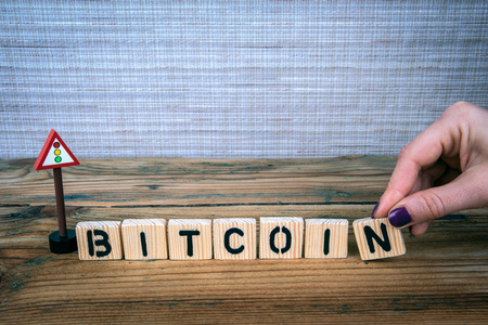 bitcoin concept. Wooden letters with road sign, informative and communication backgroundの写真素材