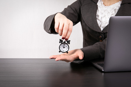 Time Management concept. Business woman with laptop