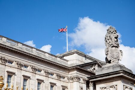 LONDON, UK - May 4, 2019. Buckingham Palace with british flag, lion with king crown, royal familyのeditorial素材