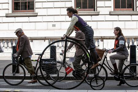 LONDON, UK - May 4, 2019. London Tweed Run. People with old bicycles and clothesのeditorial素材