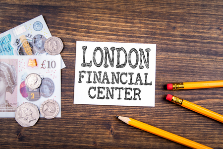 London Financial Center. UK pound,money of United kingdom close-up on wooden backgroundの写真素材