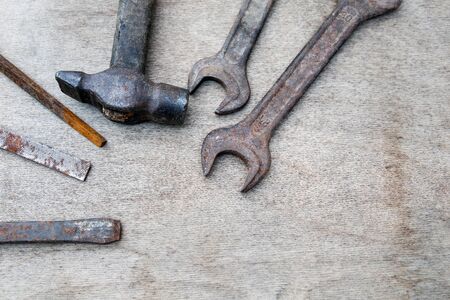 Different construction and hand tools on wooden board, maintenance and reparing conceptの写真素材