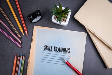 Skill Training concept. Notebook and pen on gray desk. Business and educational background