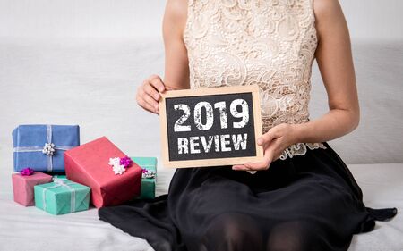 2019 review text on chalkboard. Merry Christmas and Happy New Year conceptの写真素材