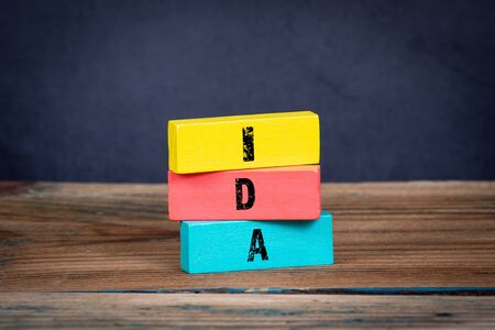 Idea concept. Office table and colorful wooden blocks with textの写真素材