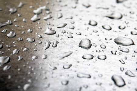 Water drops on shiny metal surface. Bad weather, wind and storm concept